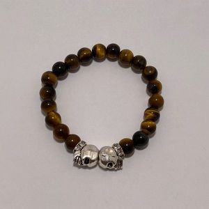 Hand made tigers eye beaded bracelet with skulls